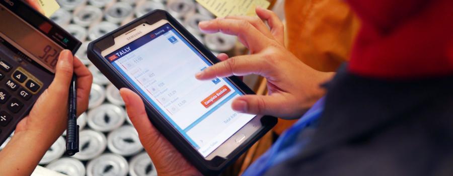 A person using the Tally software by ThisFish Inc. on a mobile device